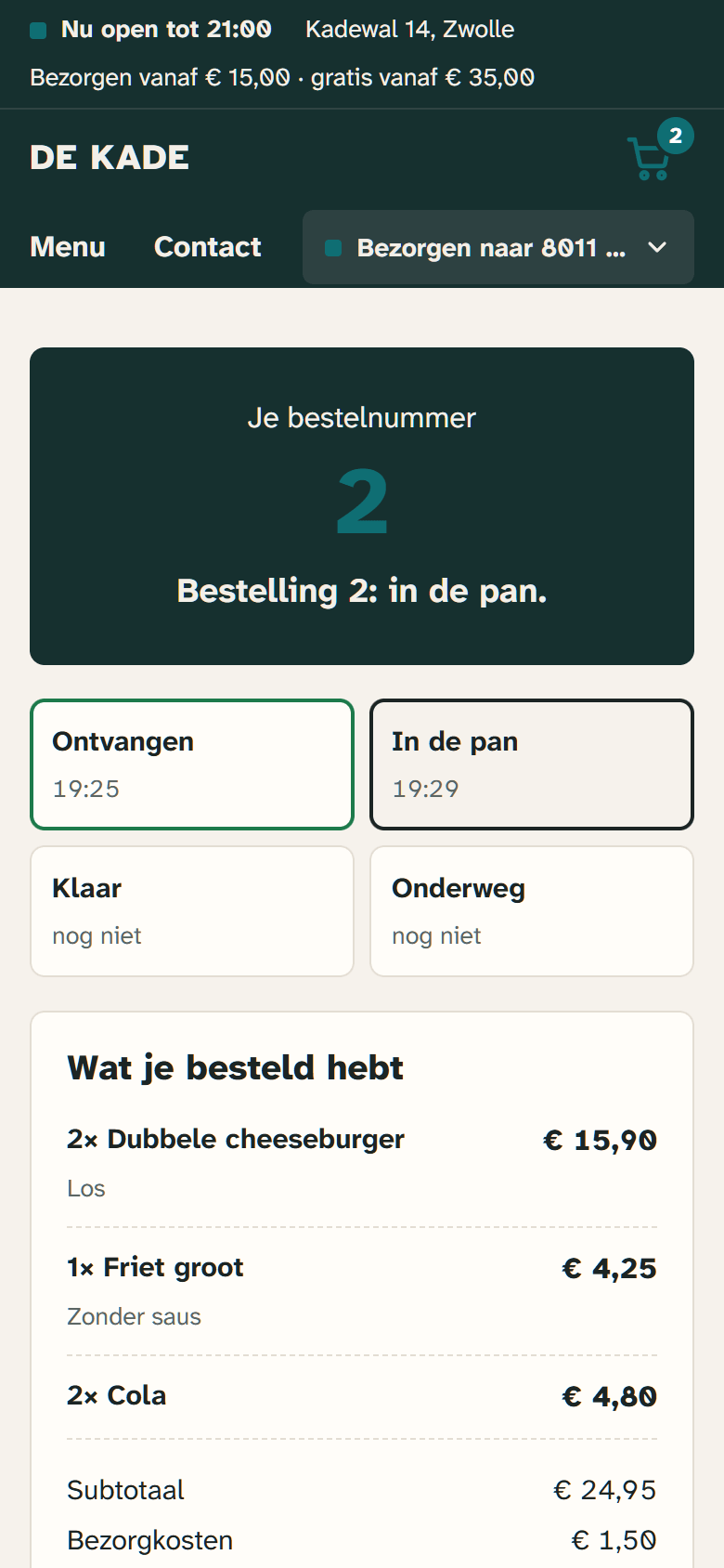 The status page of a delivery order on a phone: received and cooking.